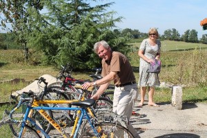 Amanda UK volunteer helps Bob with the cycles