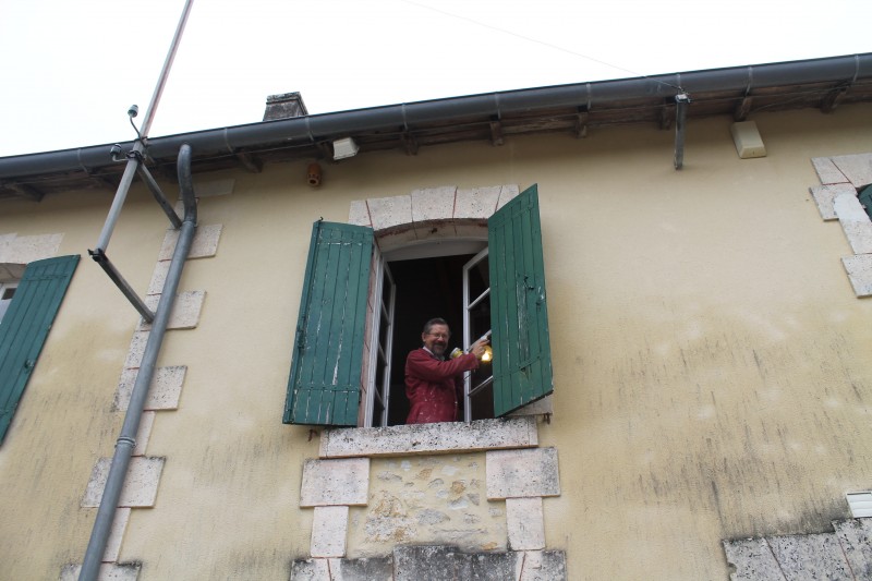 Australian volunteer repairing the shutters