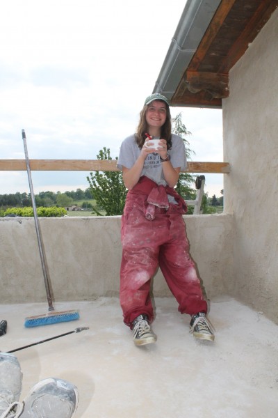 Katherine takes a coffee break after a full day rendering a balcony wall in South West France