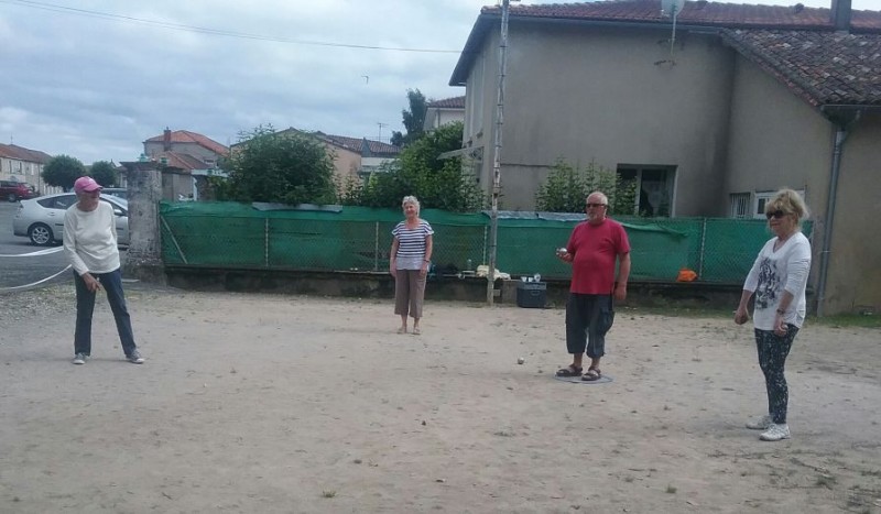Volunteers getting into the game of Petanque
