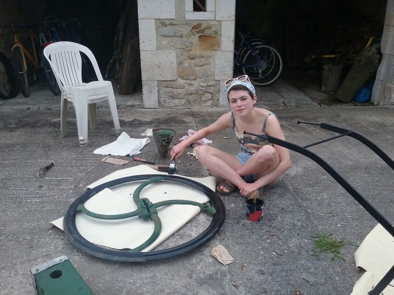 Odile creating an artistic piece of work to place in an outside area