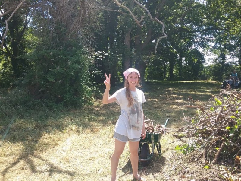 Elena from Russia gets into the clearing up in the yard.