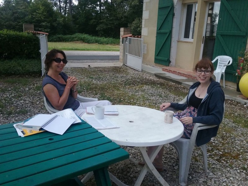 Kathryn intern from Scotland taking her one on one intensive French lesson. Outdoors in the garden of La Giraudiere.