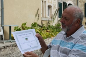 Ted, after receiving his certificate for volunteering with us